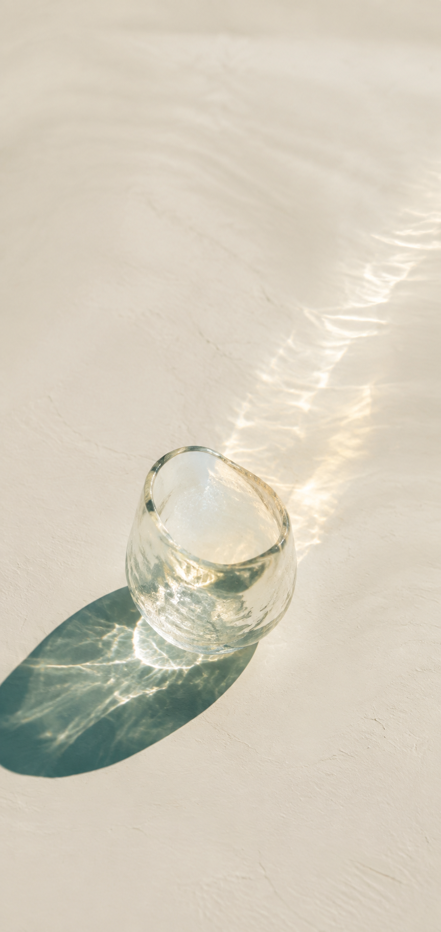 Warm light refracting through handmade glass